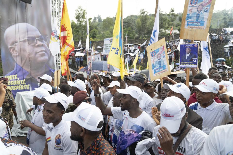 Supporters wait for the arrival of Democratic Republic of the Congo President Felix Tshisekedi at a rally in Goma, Eastern Congo, Sunday, Dec. 10, 2023. Tshisekedi is seeking reelection in the Dec. 20 elections. (AP Photo/Moses Sawasawa)