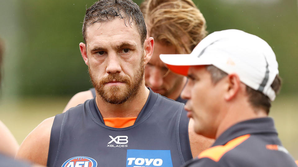 GWS big man Shane Mumford is pictured here listening to coach Leon Cameron.