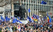 Demonstrators holding EU flags gather in Parliament Square in London during an anti-Brexit, pro-European Union (EU) march in London on March 25, 2017