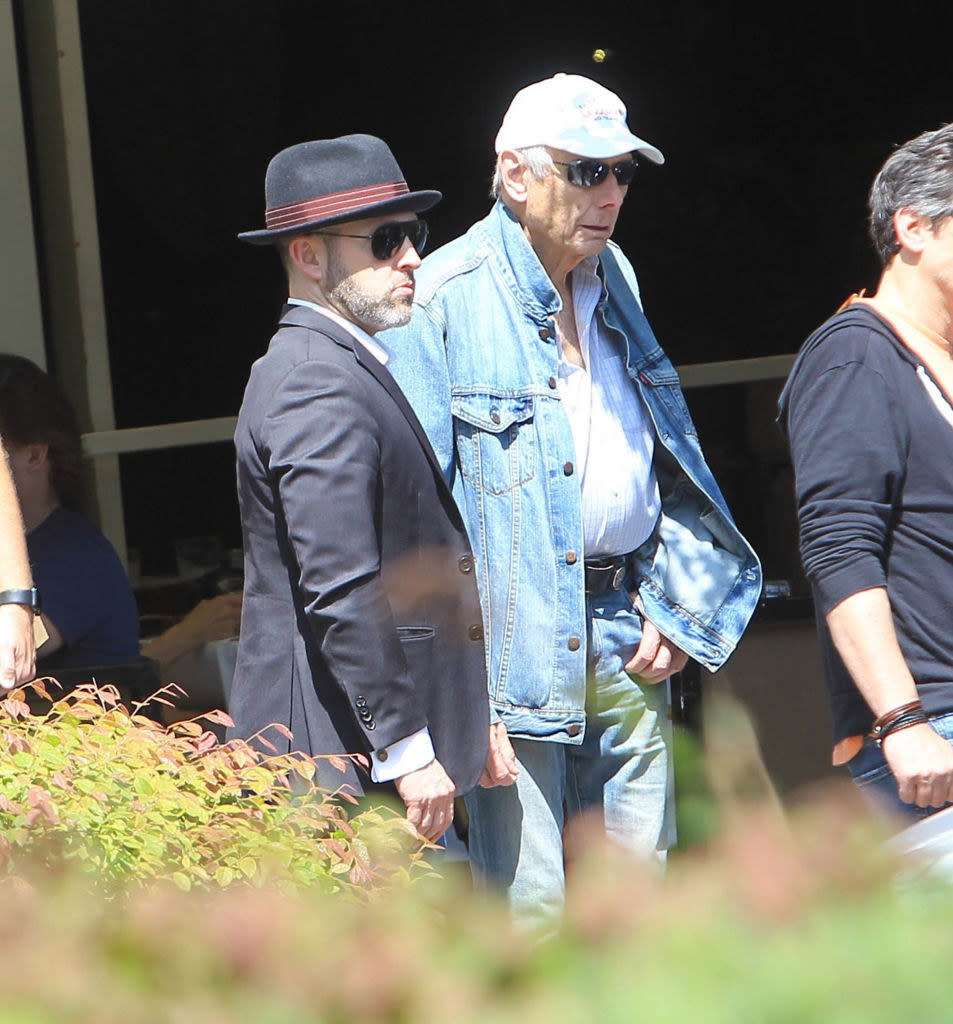 Jeff and Richard wearing hats and sunglasses and standing together