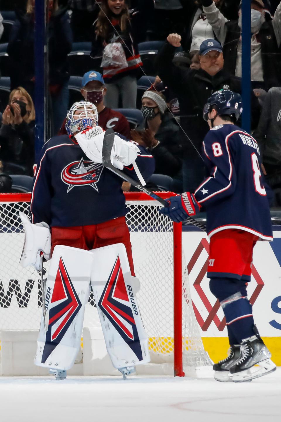 Columbus Blue Jackets goaltender Elvis Merzlikins (90) looks to the banner over the bench honoring Matiss Kivlenieks after their 4-2 victory over the Colorado Avalanche at Nationwide Arena in Columbus, Ohio Nov. 6.