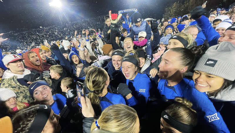 BYU players celebrate their win over North Carolina with fans after the NCAA tournament quarterfinals in Provo on Friday, Nov. 24, 2023. BYU won 4-3.