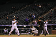 Gerardo Parra #8 of the Colorado Rockies takes an at bat in front of empty stands as catcher Francisco Cervelli #29 of the Pittsburgh Pirates backs up the plate and umpire Dale Scott oversees the action at Coors Field on April 26, 2016 in Denver, Colorado. The Pirates defeated Rockies 9-4. (Photo by Doug Pensinger/Getty Images)