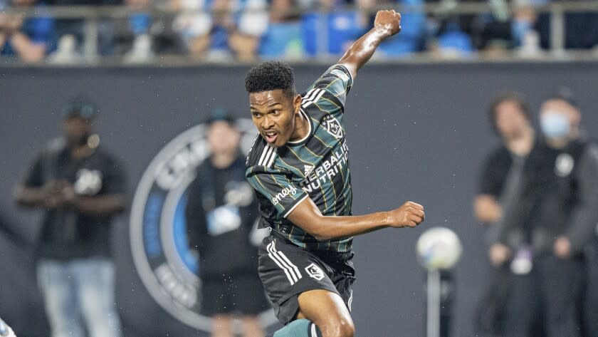 LA Galaxy midfielder Rayan Raveloson (6) plays against the Charlotte FC during the second half of an MLS soccer match in Charlotte, N.C., Saturday, March 5, 2022. (AP Photo/Jacob Kupferman)