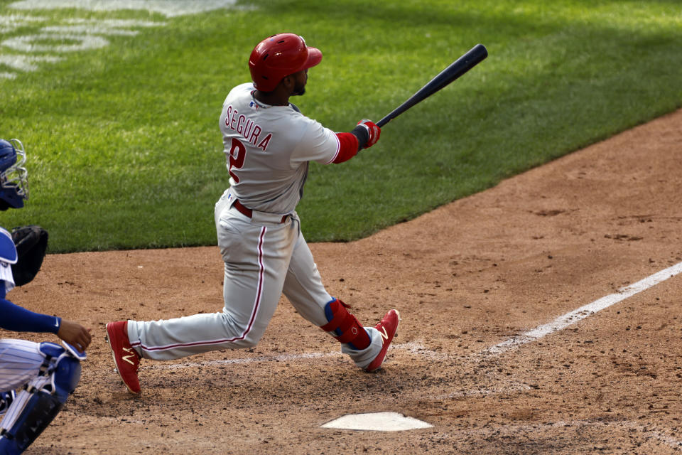 Philadelphia Phillies' Jean Segura hits a two-run home run during the 10th inning of a baseball game against the New York Mets on Monday, Sept. 7, 2020, in New York. (AP Photo/Adam Hunger)