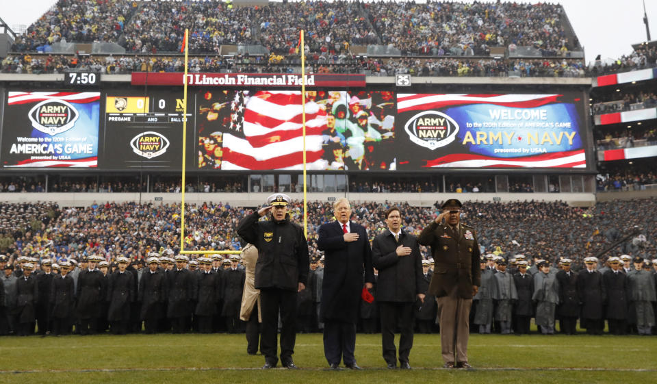 President Donald Trump stands for the Pledge of Allegiance before the start of the Army-Navy college football game in Philadelphia on Saturday. (AP Photo/Jacquelyn Martin)