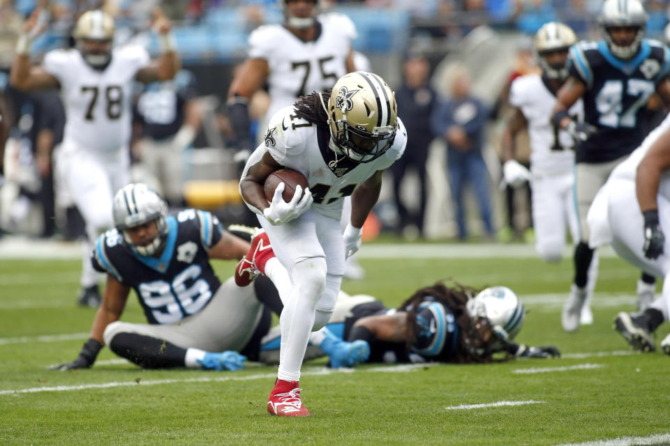 New Orleans Saints running back Alvin Kamara (41) runs for a touchdown against the Carolina Panthers during the first half of an NFL football game in Charlotte, N.C., Sunday, Dec. 29, 2019. (AP Photo/Brian Blanco)