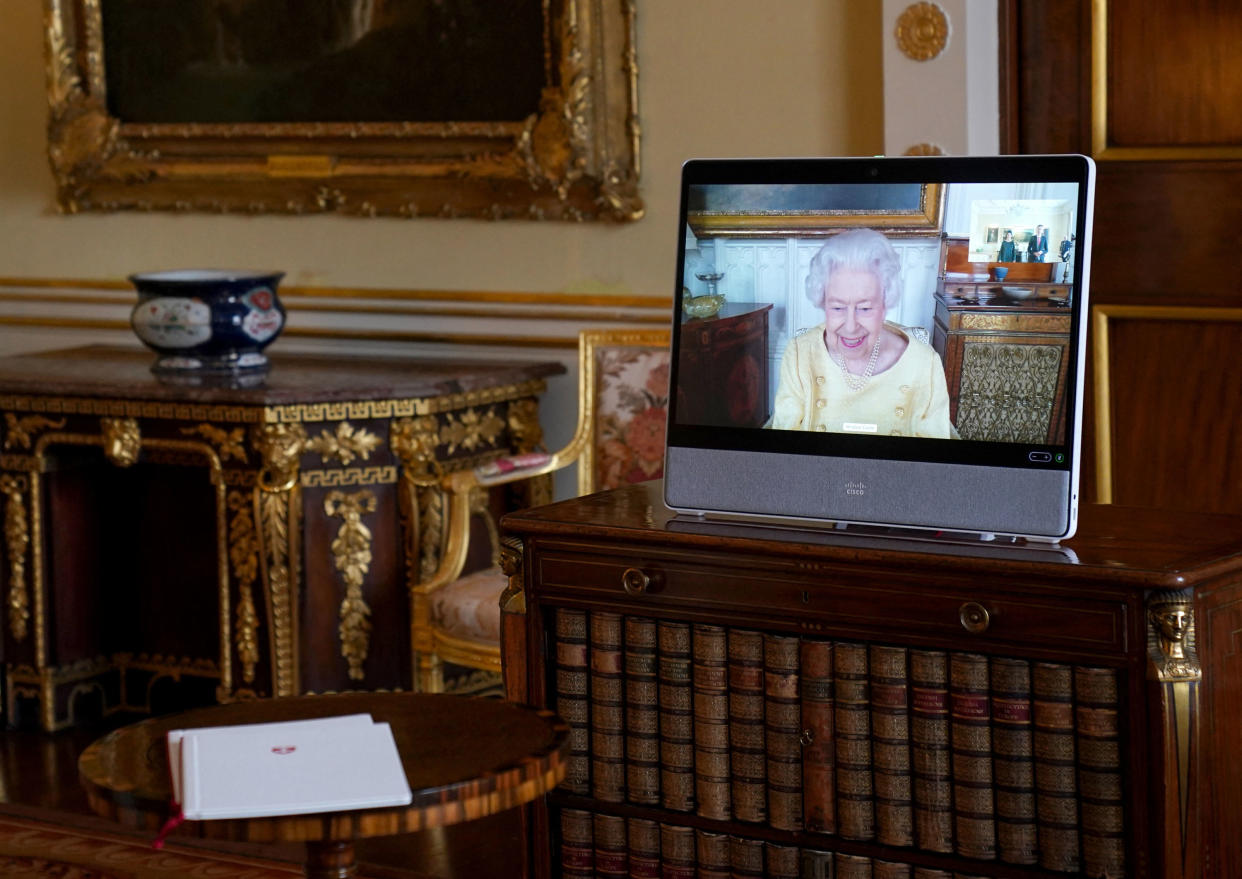 Britain's Queen Elizabeth II appears on a screen via videolink from Windsor Castle, during a virtual audience, at Buckingham Palace in London on October 26, 2021. (Photo by Victoria Jones / POOL / AFP) (Photo by VICTORIA JONES/POOL/AFP via Getty Images)