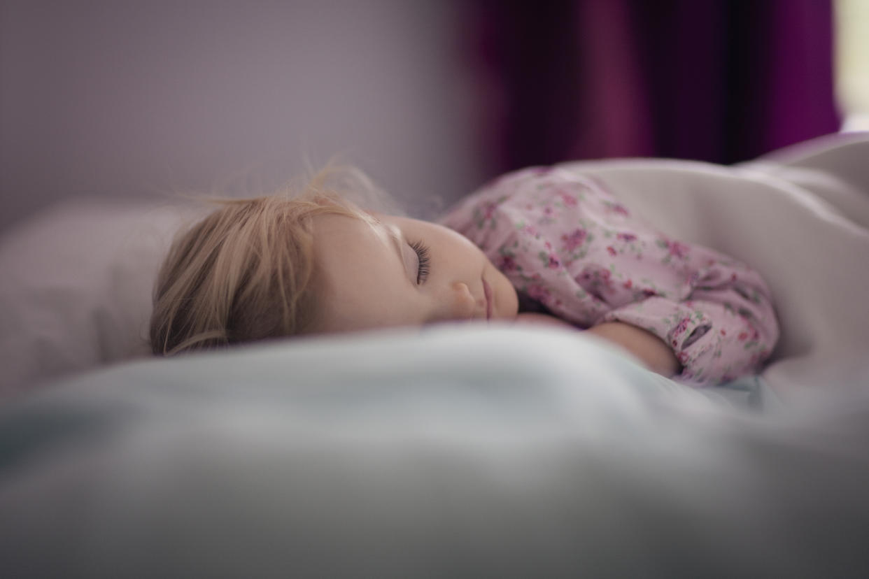 A mum has revealed her unusual time-saving hack of putting her children to bed in their clothes [Photo: Getty]