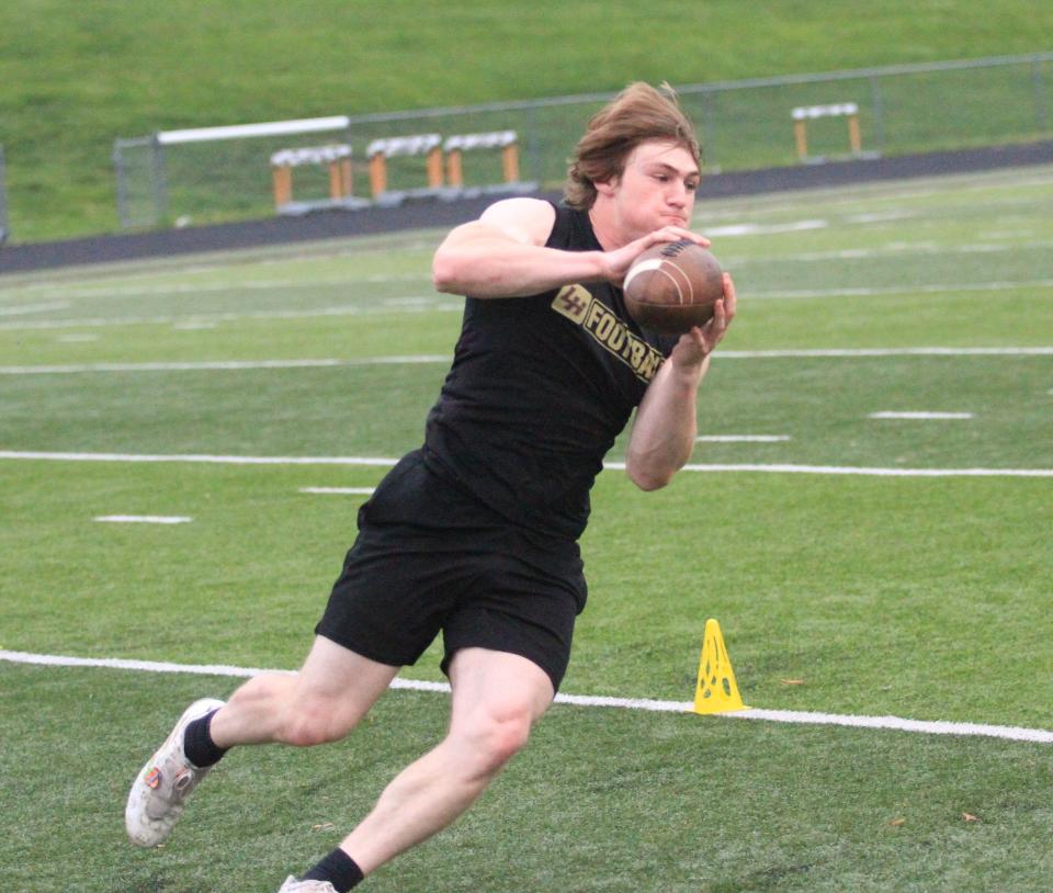 Licking Heights' Jake Lopinto catches a pass in a drill Thursday during a Licking County college football scouting combine.