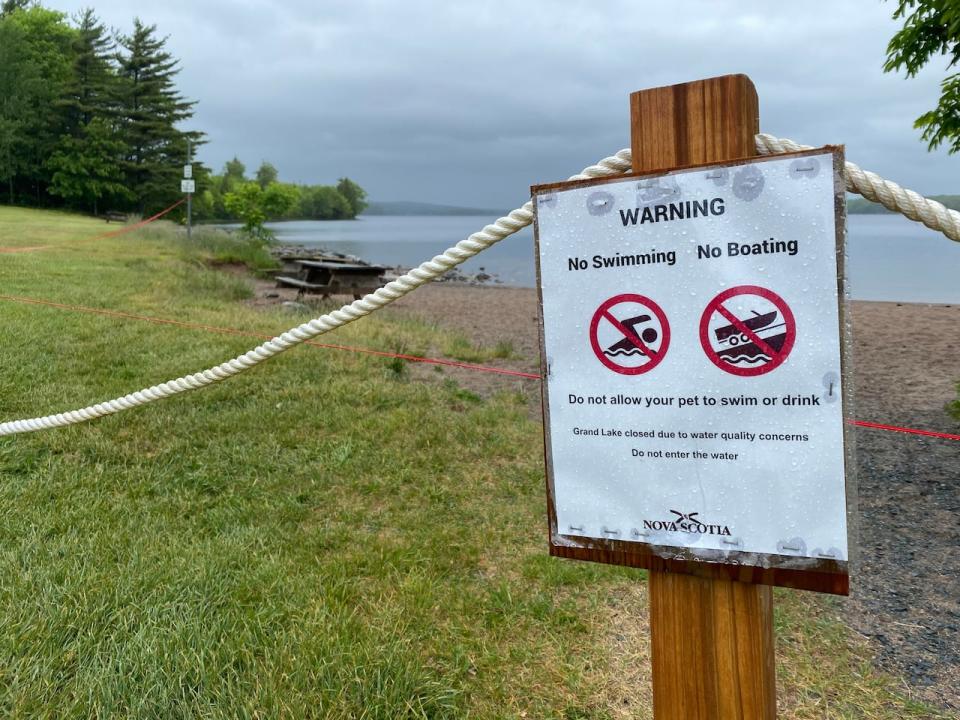 A warning sign at Oakfield Provincial Park on June 15. Toxins associated with blue-green algae have been confirmed in nearby Grand Lake.