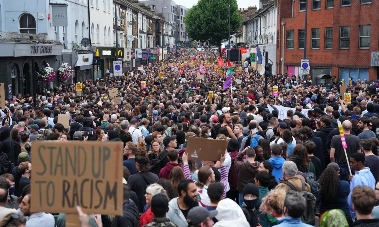 <span>An anti-racism counter protest in Walthamstow in early August after violent disorder was seen across England in the days after three young girls were killed in Southport. </span><span>Photograph: Carl Court/Getty Images</span>