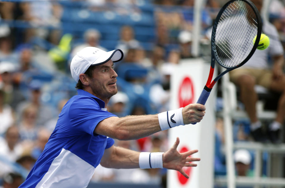 Andy Murray, of Britain, hits a forehand volley against Richard Gasquet, of France, during first-round play at the Western & Southern Open tennis tournament Monday, Aug. 12, 2019, in Mason, Ohio. (AP Photo/Gary Landers)
