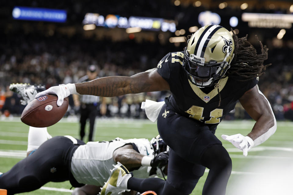 New Orleans Saints running back Alvin Kamara tries to score but is run out of bounds at the 1-yard line by the Jacksonville Jaguars defense in the second half of an NFL football game in New Orleans, Thursday, Oct. 19, 2023. (AP Photo/Butch Dill)