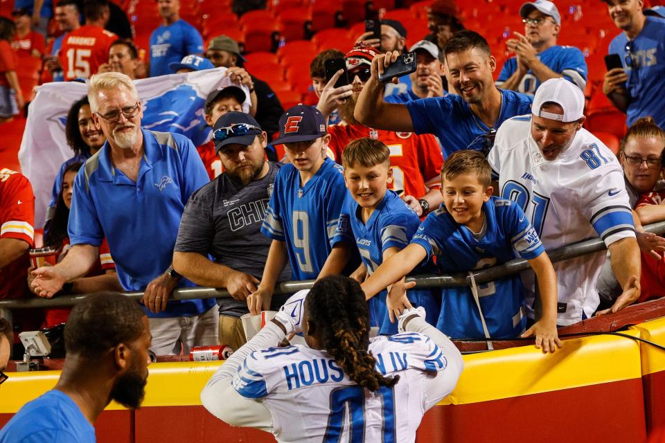 Detroit Lions linebacker James Houston high-fives fans after 21-20 win over Kansas City Chiefs at Arrowhead Stadium in Kansas City, Mo. on Thursday, Sept. 7, 2023.