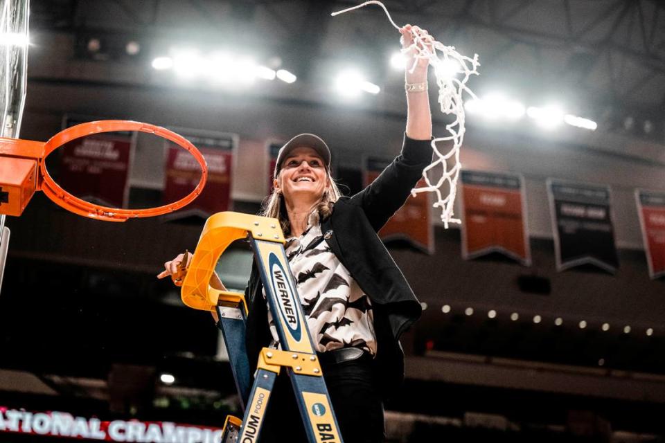 Transylvania women’s basketball head coach Juli Fulks cuts down the net after the Pioneers’ victory in the NCAA Division III national championship game at Dallas last season. Transylvania University