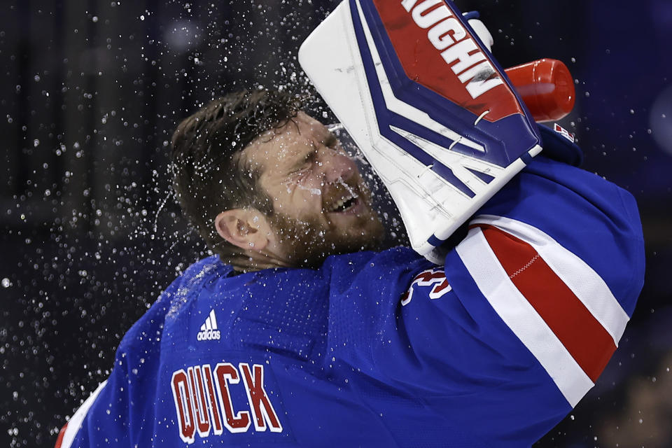 New York Rangers goaltender Jonathan Quick sprays water on his face before the first period of an NHL hockey game against the Detroit Red Wings, Tuesday, Nov. 7, 2023, in New York. (AP Photo/Adam Hunger)