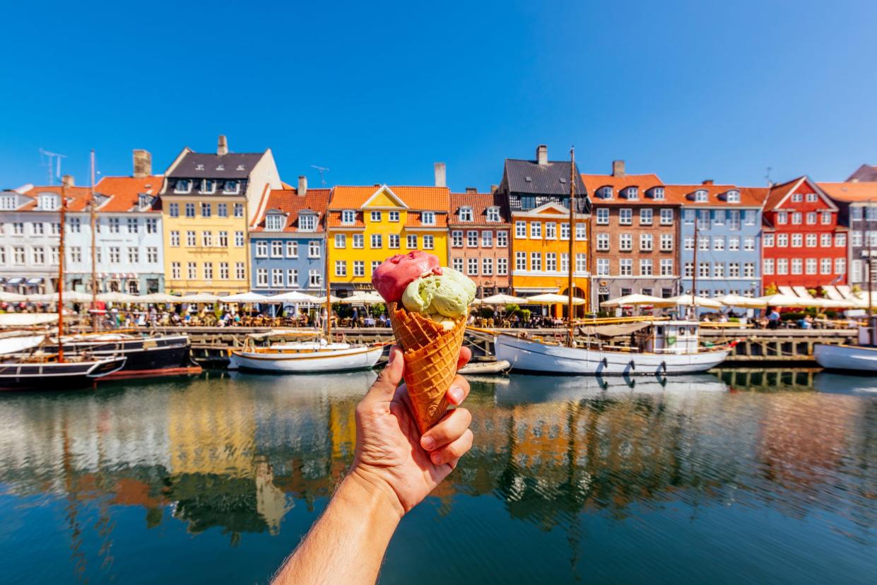 ice cream in front of colorful houses in copenhagen