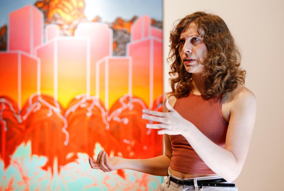 Missouri State visual studies graduate student Mara Cressey talks about the exhibition she co-curated called "The Figure, Reclaimed" at the Carolla Arts Exhibition Center on Wednesday July 12, 2023.