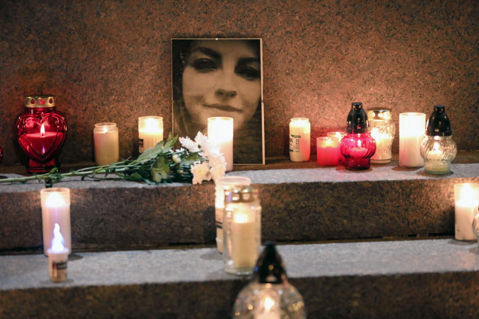 People light candles next to a picture of Izabela, a 30-year-old woman who died in the 22nd week of pregnancy with activists saying she could still be alive if the abortion law wouldn't be so strict in Lublin, Poland November 6, 2021. Jakub Orzechowski/Agencja Wyborcza.pl via REUTERS   ATTENTION EDITORS - THIS IMAGE WAS PROVIDED BY A THIRD PARTY. POLAND OUT. NO COMMERCIAL OR EDITORIAL SALES IN POLAND.