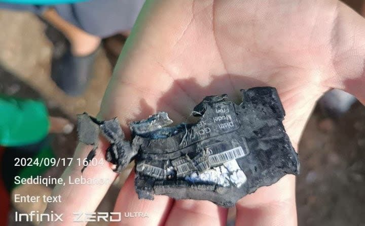 A burnt pager can be seen after the explosion in Lebanon