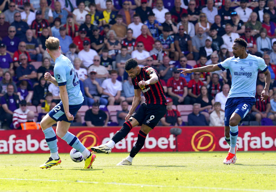 Bournemouth's Dominic Solanke scores a goal before a VAR check then disallows it for handball, during the English Premier League soccer match between Brentford and Bournemouth, at the Vitality Stadium, in Bournemouth, England, Saturday, May 11, 2024. (Andrew Matthews/PA via AP)