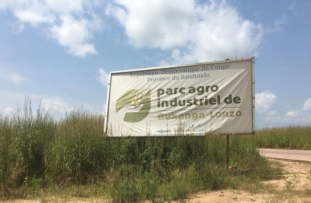 A signboard is seen along the road leading to the Bukanga Lonzo agro-industrial park in Bukanga-Lonzo, western Democratic Republic of Congo, April 27, 2018. Picture taken April 27, 2018. REUTERS/Patient Ligodi