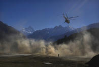 A helicopter carrying Indian army soldiers takes off during Indo-US joint exercise or "Yudh Abhyas, in Auli, in the Indian state of Uttarakhand, Tuesday, Nov. 29, 2022. Militaries from India and the U.S. are taking part in a high-altitude training exercise in a cold, mountainous terrain close to India's disputed border with China. The training exercise began two weeks ago. India's defence ministry statement said the joint exercise is conducted annually with the aim of exchanging best practices, tactics, techniques and procedures between the armies of the two nations, which is under Chapter of the UN Mandate. (AP Photo/Manish Swarup)