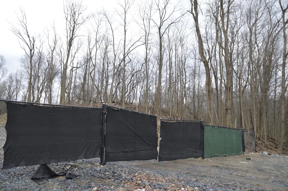 Barriers are visible in the area where land was cleared in Orange County's Gonzaga Park. The county is suing South Blooming Grove and its contractors for beginning to build a road through the park, according to the county's lawyer.