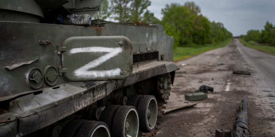 The letter Z, which has become the Russian emblem for the war, is seen on a blown Russian APC near Kutuzivka, east Ukraine, Friday, May 13, 2022.