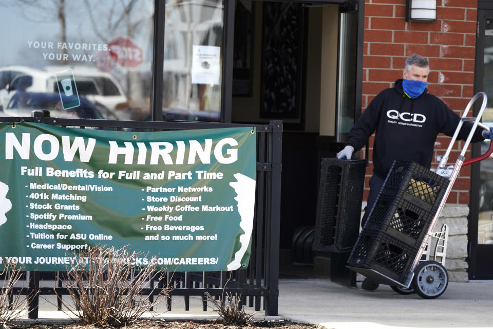 FILE - A hiring sign is displayed outside of a Starbucks in Schaumburg, Ill., Friday, April 1, 2022. More Americans applied for jobless aid last week but the total number of Americans collecting unemployment remains at a five-decade low. Applications for unemployment benefits rose by 27,000 to 229,000 for the week ending June 4, the most since mid-January, the Labor Department reported Thursday, June 9, 2022. (AP Photo/Nam Y. Huh, File)