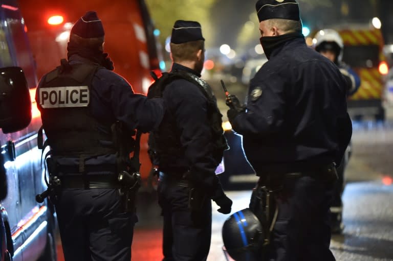 Police cordon off the area close to where armed men have taken hostages in the northern French town of Roubaix, on November 24, 2015