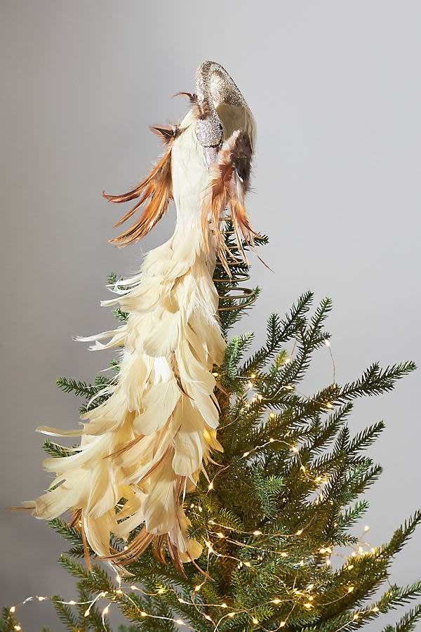 <p><a href="https://go.redirectingat.com?id=74968X1596630&url=https%3A%2F%2Fwww.anthropologie.com%2Fshop%2Fpeacock-tree-topper2&sref=https%3A%2F%2Fwww.townandcountrymag.com%2Fleisure%2Fg42145590%2Fbest-christmas-tree-topper-ideas%2F" rel="nofollow noopener" target="_blank" data-ylk="slk:Shop Now;elm:context_link;itc:0;sec:content-canvas" class="link ">Shop Now</a></p><p>Peacock Tree Topper</p><p>anthropologie.com</p><p>$58.00</p>