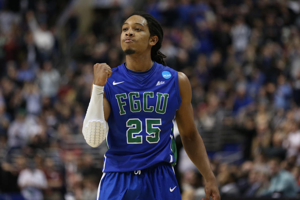 Sherwood Brown, star of Florida Gulf Coast’s original Dunk City team, pumps his fist during the Georgetown upset. (Getty)