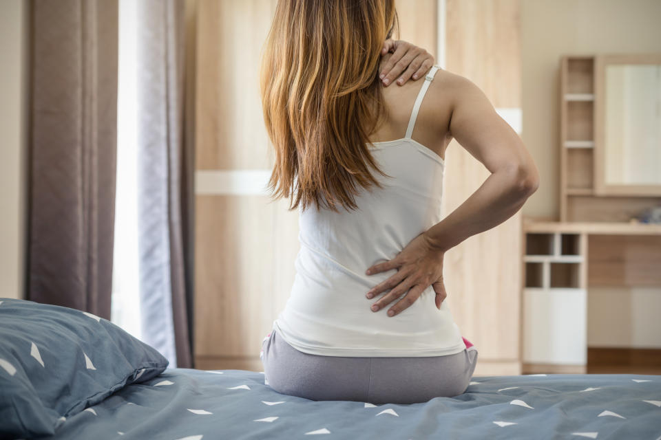 Back pain can be debilitating — here's how to get help. (Photo: Getty)