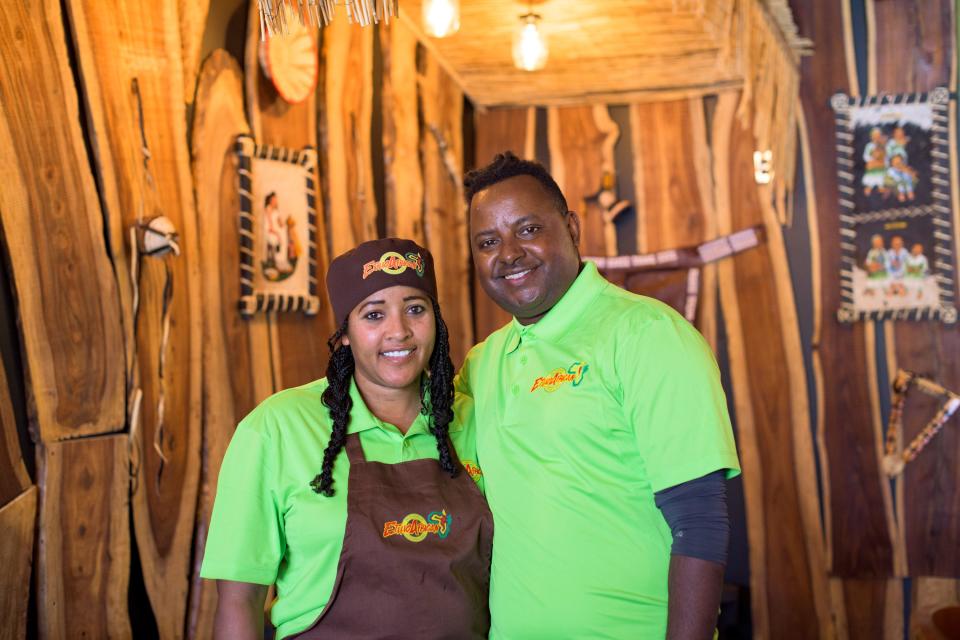 Owner of Ethiopian restaurant, Authentic EthioAfrican Kitchen and Bar, Anduale Hassan, right, and wife, Elsabet Tiruneh stand by the jazz bar in the back of the restaurant in Phoenix on Jan. 9, 2022, after recently renovating and re-opening.