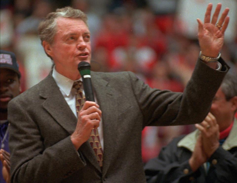 Retiring Nebraska coach Tom Osborne acknowledges a standing ovation from the crowd of 15,000 who attended a rally at the Devaney Sports Center in Lincoln, Neb., Saturday, Jan. 3, 1998, to honor the team's Orange Bowl victory. (AP Photo/Dennis Grundman)