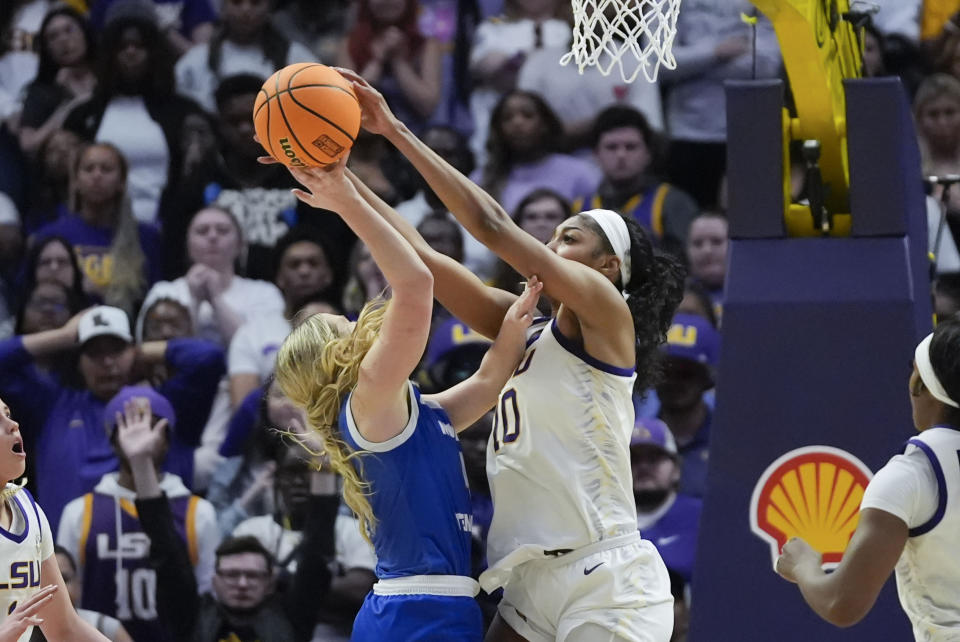 LSU forward Angel Reese (10) blocks a shot by Middle Tennessee guard Savannah Wheeler during the second half of a second-round college basketball game in the women's NCAA Tournament in Baton Rouge, La., Sunday, March 24, 2024. LSU won 83-56. (AP Photo/Gerald Herbert)