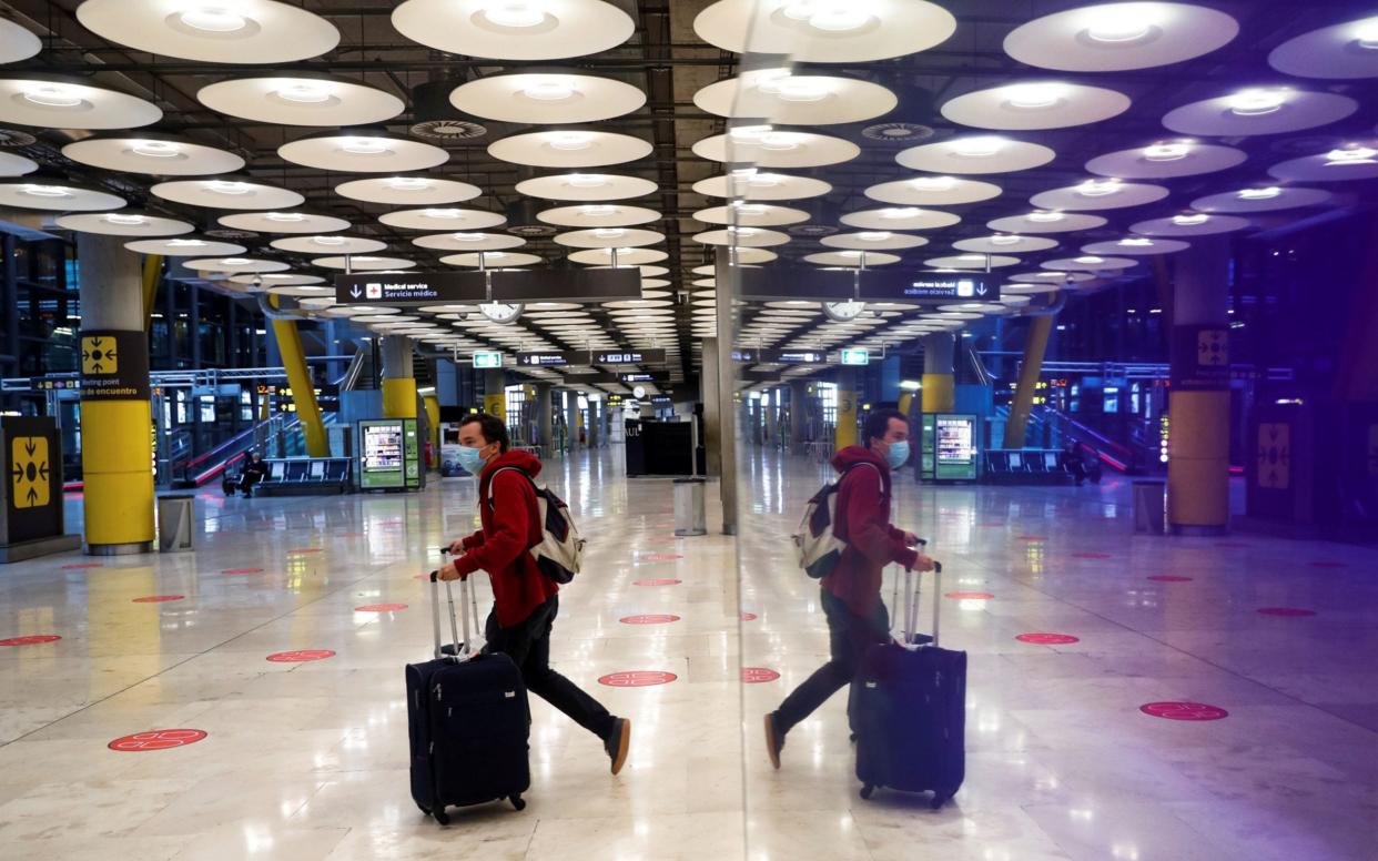 A traveller arriving in Madrid  - Emilio Naranjo/EPA-EFE/Shutterstock