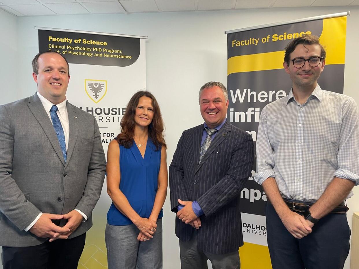 From left, Brian Comer, minister responsible for the Office of Mental Health and Addictions, Dr. Shannon Johnson, clinic co-director, Chuck Macdonald, Dalhousie dean of science and Patrick Hickey, a clinical psychology PhD student. They attended the official opening of  Dalhousie Centre for Psychological Health on Tuesday. (Celina Aalders - image credit)