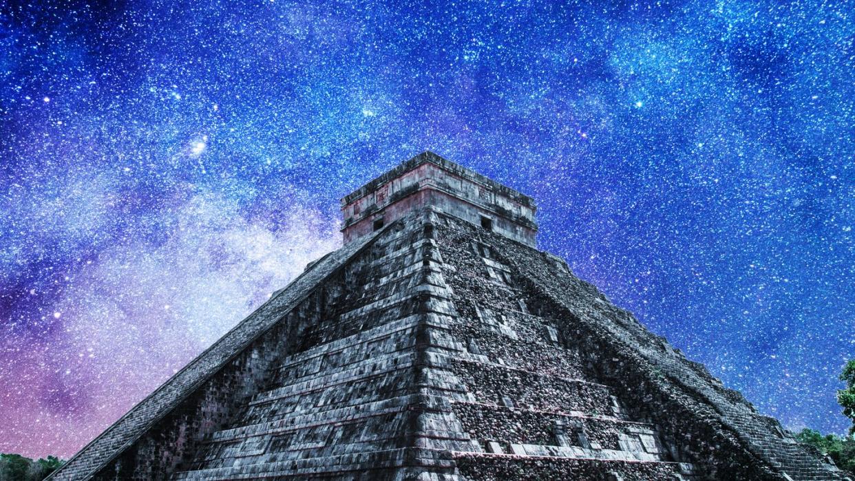 temple of kukulkan with galactic night background