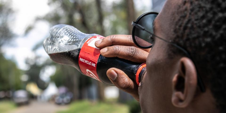 person drinking Coca Cola