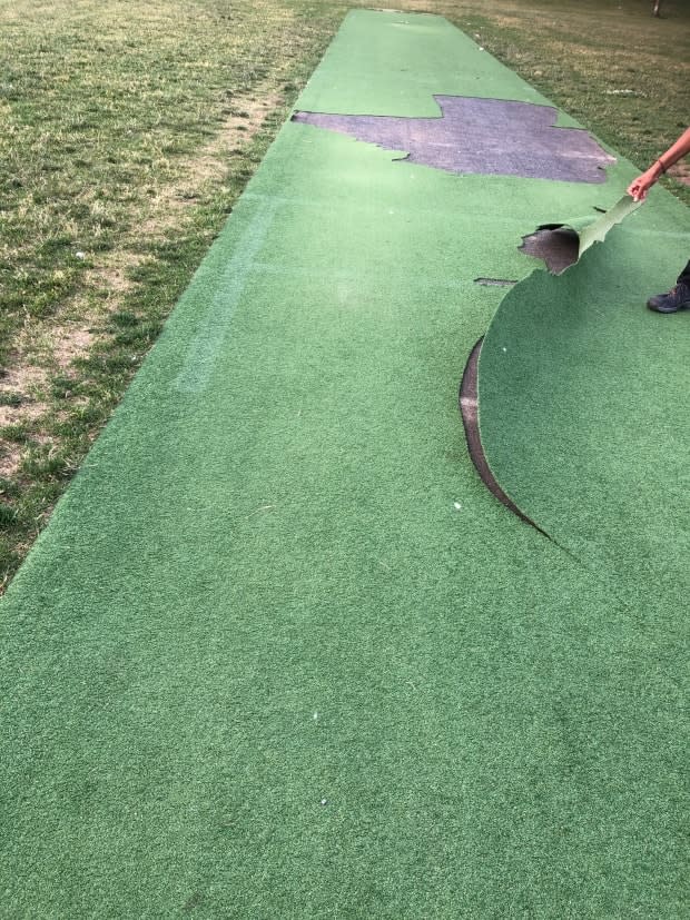 Damage done to artificial turf on a public cricket pitch in CDN-NDG means 10 cricket teams won't be able to play at Van Horne park until the borough is able to secure replacement materials and make repairs. (Raveen Nagarajah - image credit)