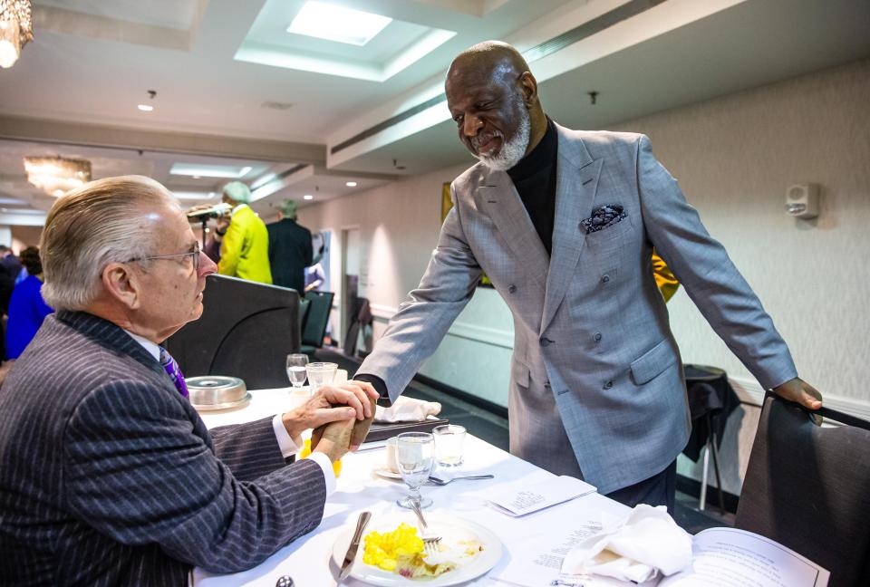 Dr. Wesley Robinson-McNeese shares a moment with former Springfield Mayor Mike Houston, left, after his keynote address during the annual Springfield Frontiers International Club Dr. Martin Luther King Jr. Memorial Breakfast in 2020.