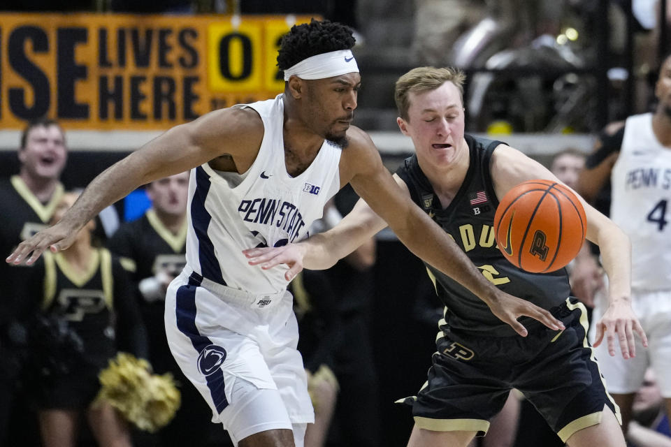 Purdue guard Fletcher Loyer (2) knocks the ball away from Penn State guard Jalen Pickett (22) from during the second half of an NCAA college basketball game in West Lafayette, Ind., Wednesday, Feb. 1, 2023. Purdue defeated Penn State 80-60. (AP Photo/Michael Conroy)