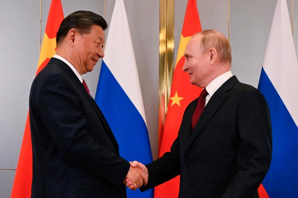 PHOTO: Russian President Vladimir Putin and Chinese President Xi Jinping shake hands during their meeting on the sidelines of the Shanghai Cooperation Organisation summit in Astana, Kazakhstan, Wednesday, July 3, 2024. (Sergey Guneyev/AP)