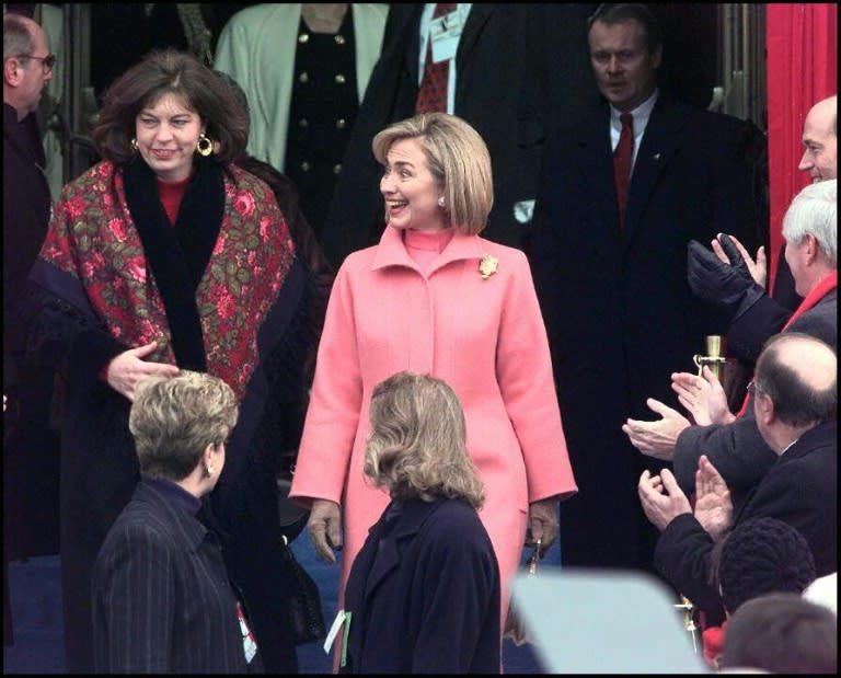 Hillary Clinton (C) arrives at the podium for the swearing-in of her husband Bill Clinton as president in 1997