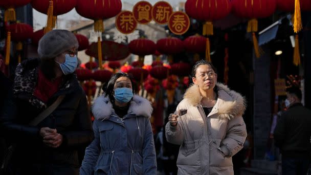PHOTO: Visitors tour a shopping alley near the Houhai Lake displaying lanterns and Lunar New Year decorations in Beijing, Chin, Jan. 16, 2023. (Andy Wong/AP)