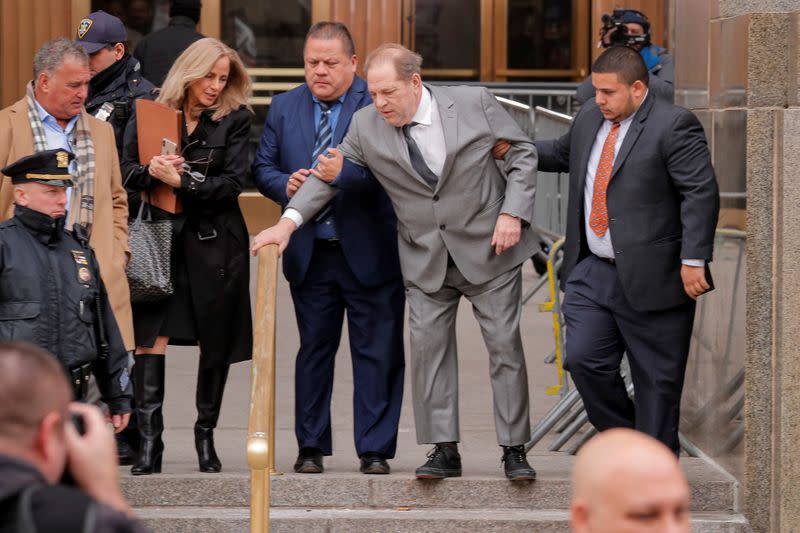 FILE PHOTO: Film producer Harvey Weinstein exits following a hearing in his sexual assault case at New York State Supreme Court in New York