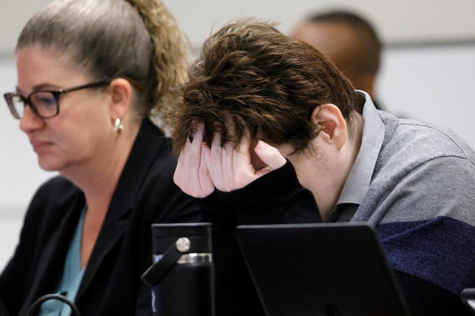 Marjory Stoneman Douglas High School shooter Nikolas Cruz rubs his eyes during the penalty phase of Cruz’s trial at the Broward County Courthouse in Fort Lauderdale on Tuesday, Oct. 4, 2022. Cruz previously plead guilty to all 17 counts of premeditated murder and 17 counts of attempted murder in the 2018 shootings. (Amy Beth Bennett/South Florida Sun Sentinel via AP, Pool)